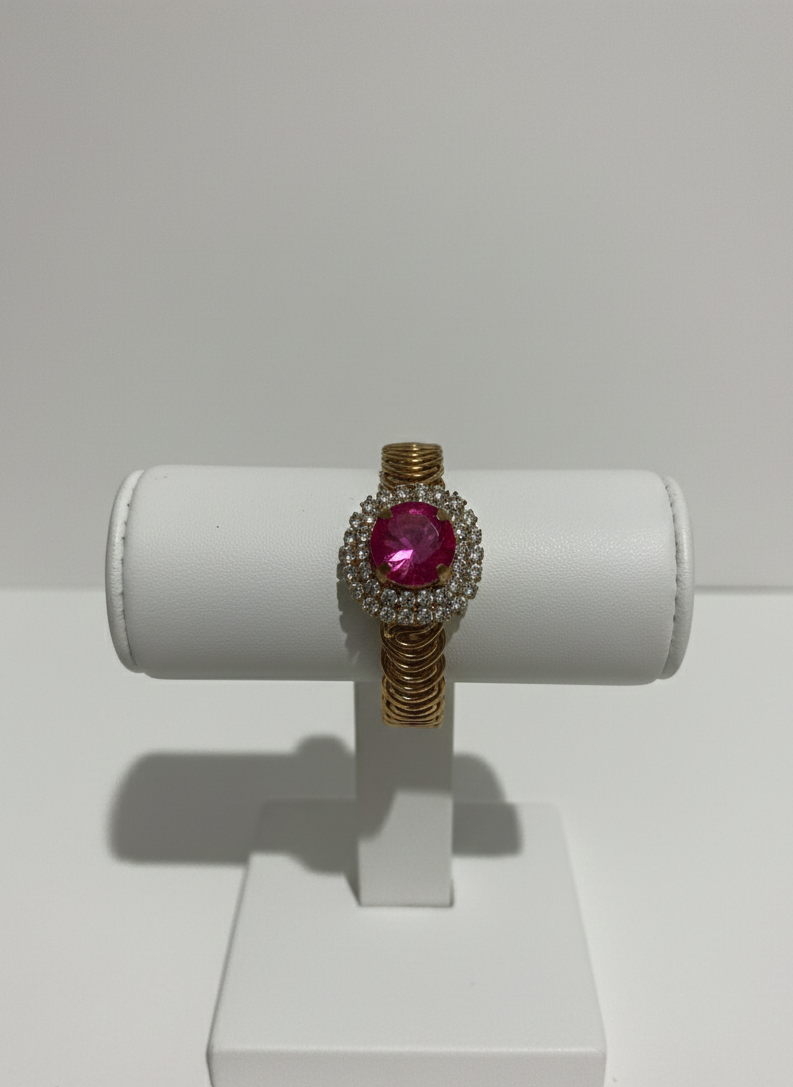 Cluster pink central stone with white studded stones Golden metal strap Bracelet