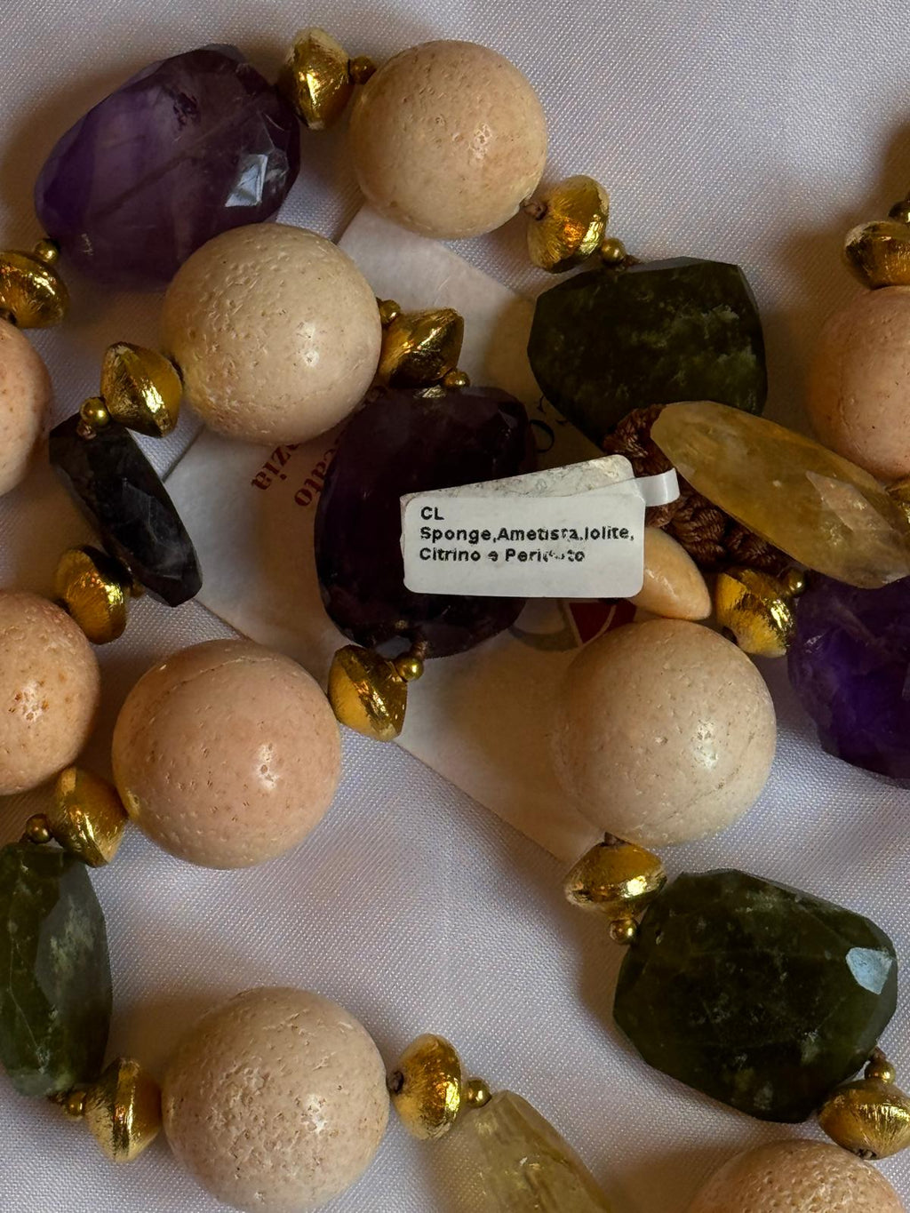 Necklace made with sponge, amethyst, citrine quartz and peridot.