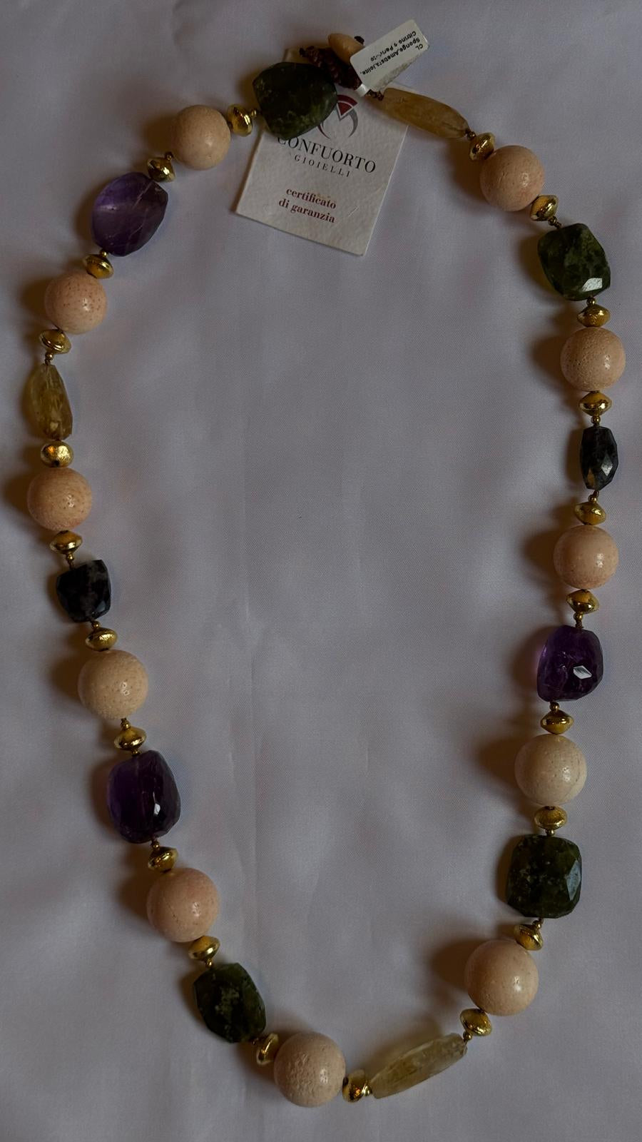 Necklace made with sponge, amethyst, citrine quartz and peridot.